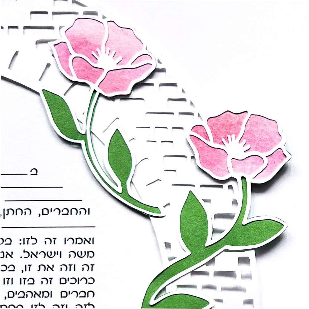 Close up of floral papercut and watercolor ketubah