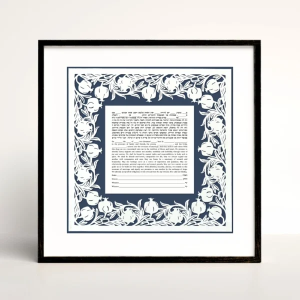 blue pomegranate papercut border around square ketubah in a black frame.