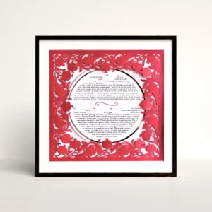 red pomegranate papercut border around circle ketubah in a black frame.