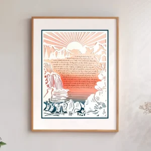 A framed paper-cut artwork ketubah depicts mountains, trees, a waterfall and river, a pair of boots, a dog, and a tent with a handwritten marriage contract at the center, beneath a sunrise. This is hanging on the wall of someone's home